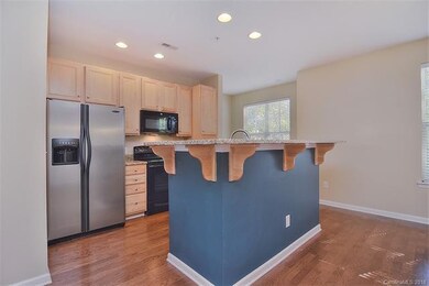 Contemporary kitchen area with breakfast bar/grani