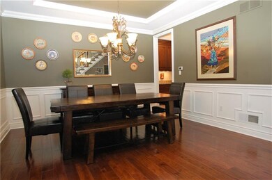 Crown molding, hardwood floors, wainscoting and a 