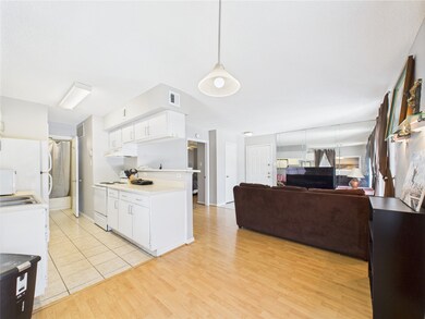 View from Dining into Kitchen & Living Area