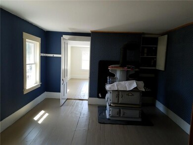 Kitchen has 2 windows on the left as...
