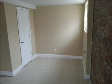 Unfurnished room with baseboards