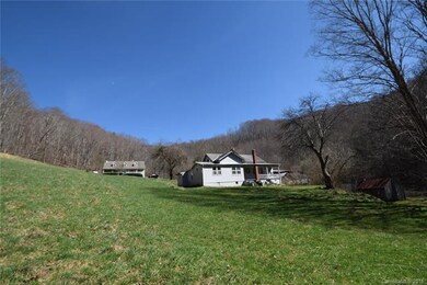 looking up past 1920 farmhouse to main house