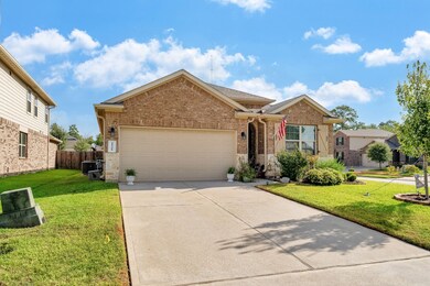 Fantastic corner lot with beautiful landscaping.  Homeowners recently replaced the tree.
