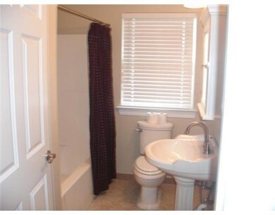 Bath. Hall bath with pedestal sink and tub/shower