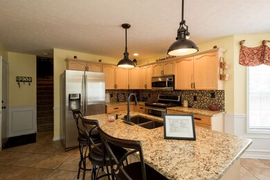 Imagine yourself chatting around this island.  Barstools stay!