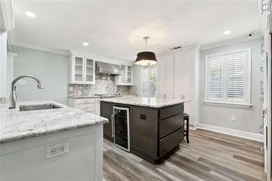 Kitchen includes wine fridge, granite countertops, new lighting
