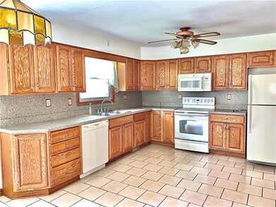 Spacious kitchen with ample counter space, applian