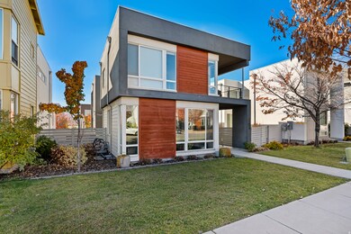 Contemporary house with a balcony and stucco siding