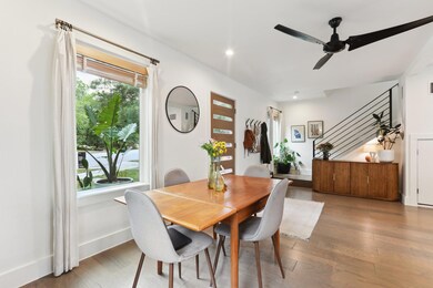 Dining room with stairs, healthy amount of natura