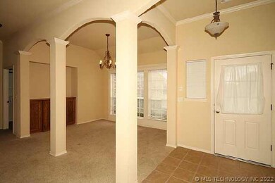 Entry and dining room. Notice arched entry.