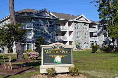 Community / neighborhood sign featuring a lawn