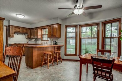 Spacious eat in kitchen with view of back yard.