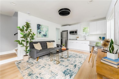 Living area featuring light wood finished floors