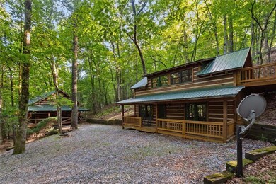 View of front of house with metal roof