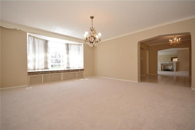 Dining room with decorative crown molding, crystal