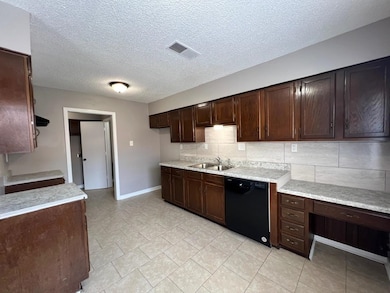 Kitchen featuring light tile patterned flooring, d
