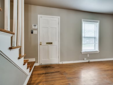 Entrance foyer featuring stairway and hardwood / wood-style floors