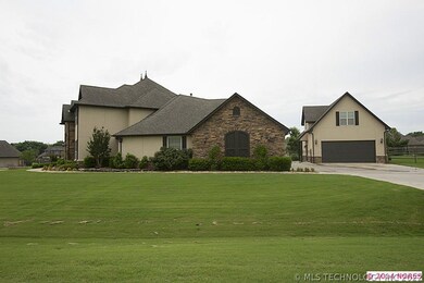 Side view of this exquisite estate on manicured co