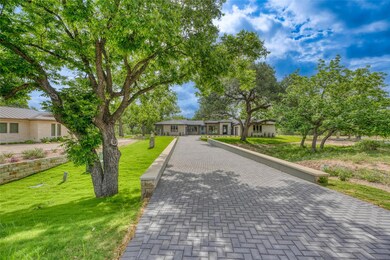 Ranch-style home with a front lawn