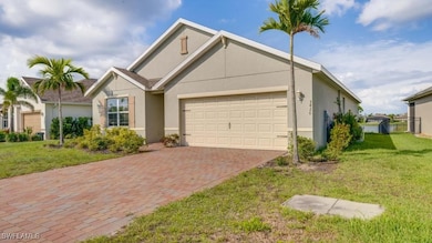 View of front of property featuring an attached ga