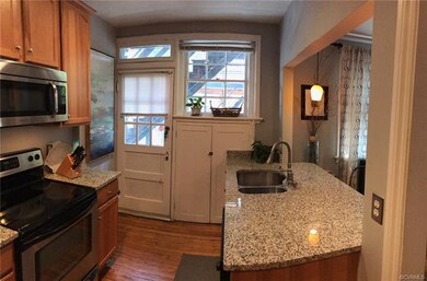 Kitchen has back door attached, along with large w