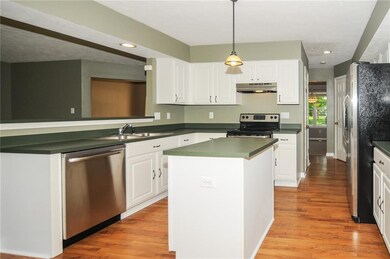 Wonderful cooks kitchen has the breakfast bar, brand new Stainless Steel appliances, updated pendant light fixtures and center island!