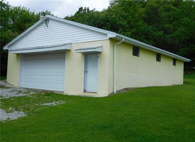 Detached garage can accommodate up to 6 cars.  Gre