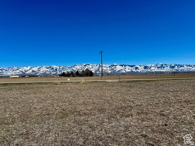 View of mountain backdrop with rural landscape