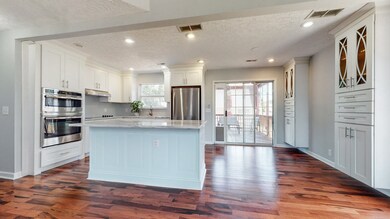 Large Island and Stainless Steel Appliance. All appliances remain. 