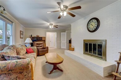 Den with large fireplace