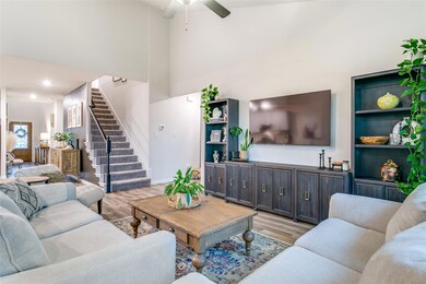 Living room featuring a towering ceiling, ceiling 