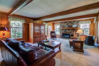 The brick fireplace is situated at the south end o