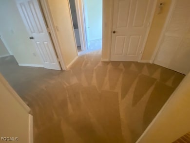 Unfurnished bedroom with carpet floors and a closet