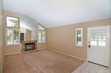 The living room with brick fireplace