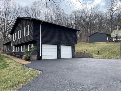 House with 2 extra deep  garage bays