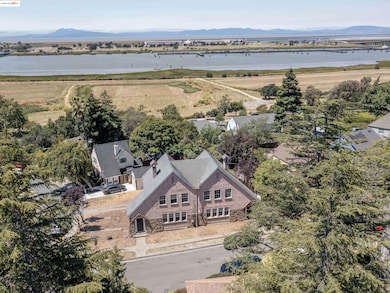 Aerial overview of property's location featuring a water and mountain view