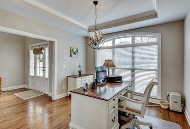 Dinning room, currently used as office, has tray ceiling, large windows that overlook driveway. Plus area ready for custom butler's pantry.