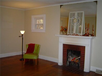 Extra large living room has a wood burning firepla