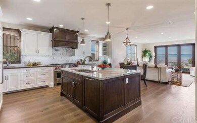 The gourmet kitchen leads to the family room with 