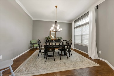 Dining area featuring an inviting chandelier, base