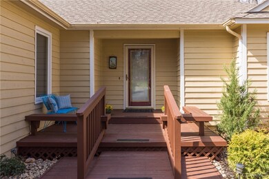 Front entryway with built-in seating benches.  Inv