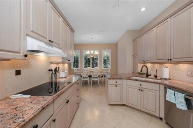 Kitchen featuring hanging light fixtures, dishwash