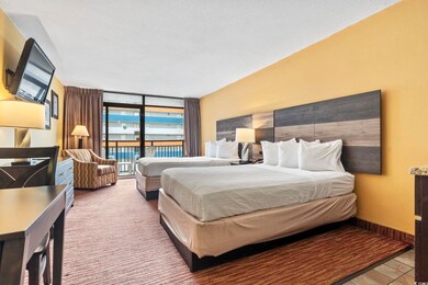 Bedroom featuring floor to ceiling windows, a text
