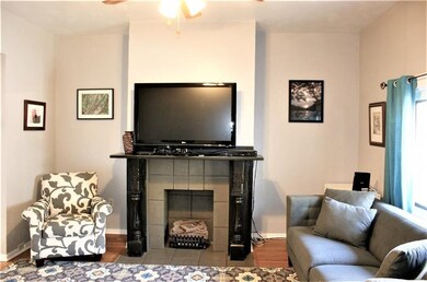 Gas log fireplace and restored original wood work 