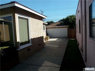 Long driveway leads to two car detached garage