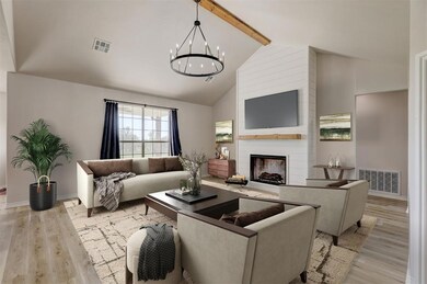 Living room with high vaulted ceiling, light hardw