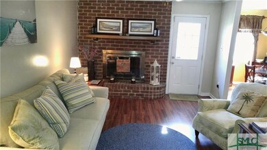 Living Room with Fireplace(Gas Logs) and Brick Hea