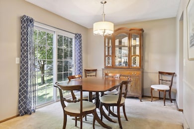 Dining area overlooks backyard.