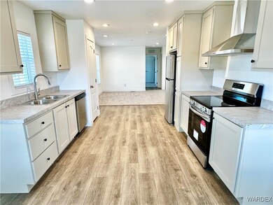 Kitchen with stainless steel finishes and low main