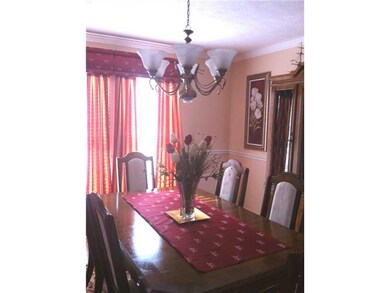 Dining Room. Gorgeous custom window treatments will remain in the dining room, beautifully filtering the light